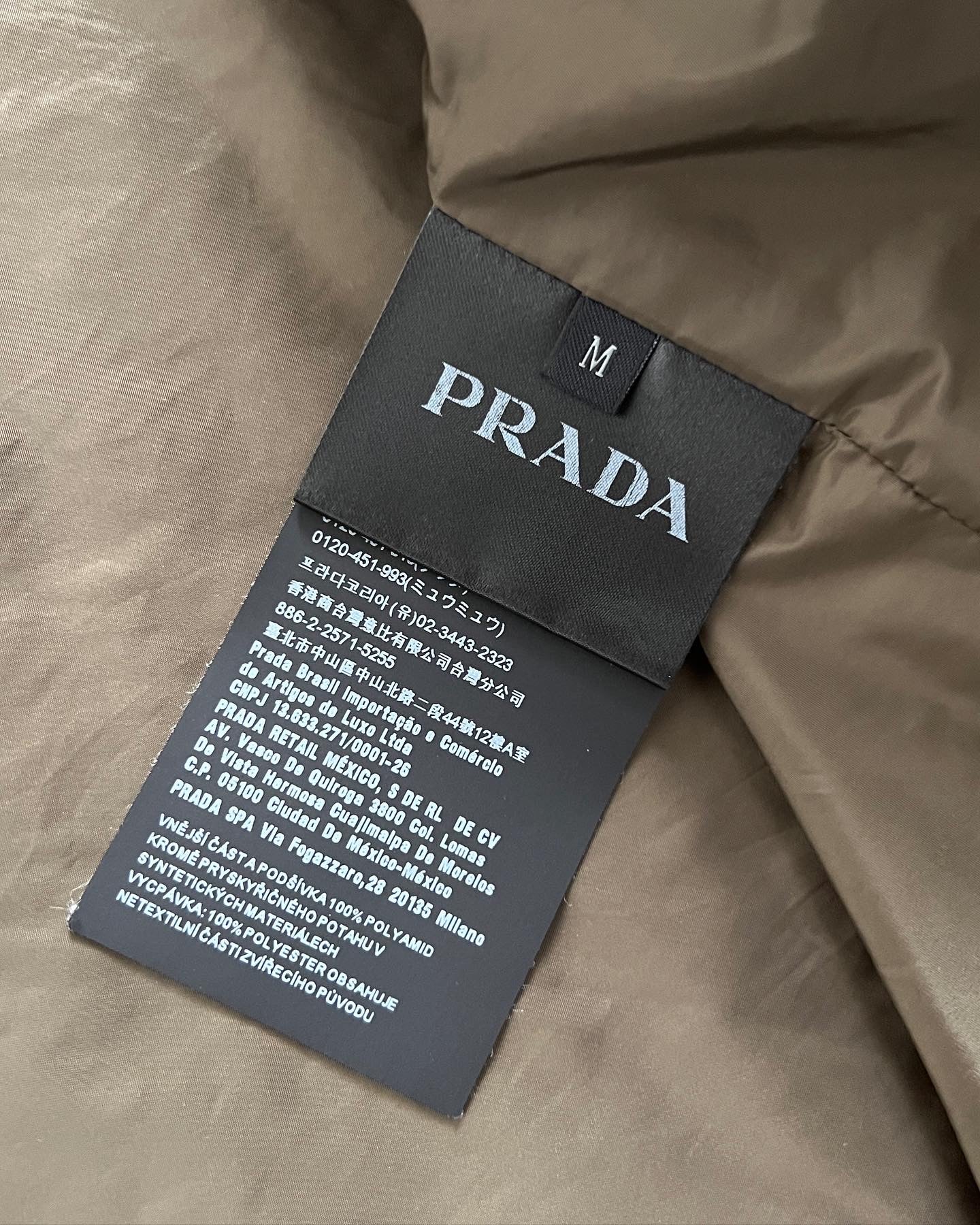 Prada AW2019 Metal Plaque Logo Padded Jacket - Size M