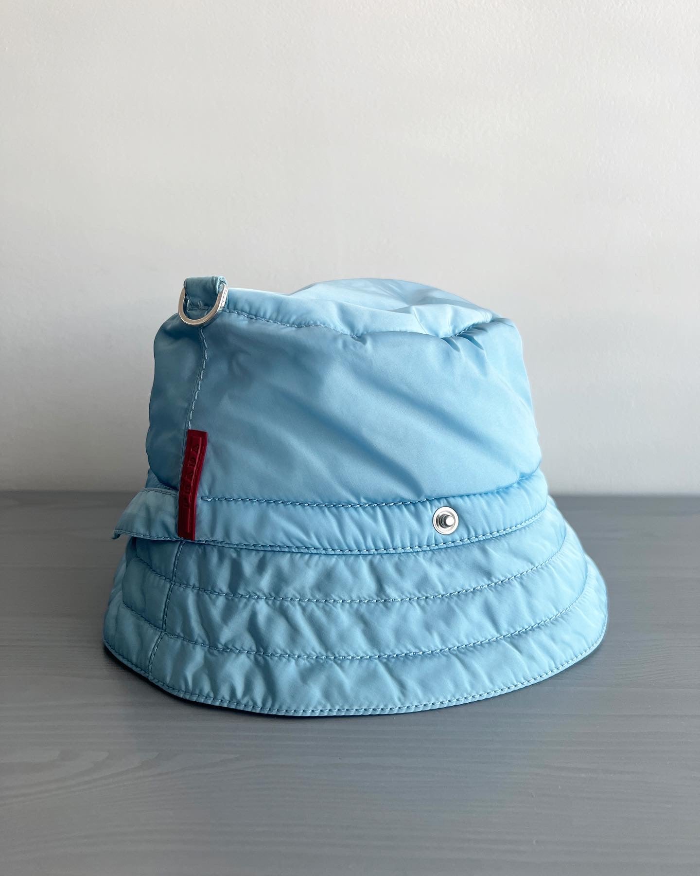 Baby blue prada online bucket hat