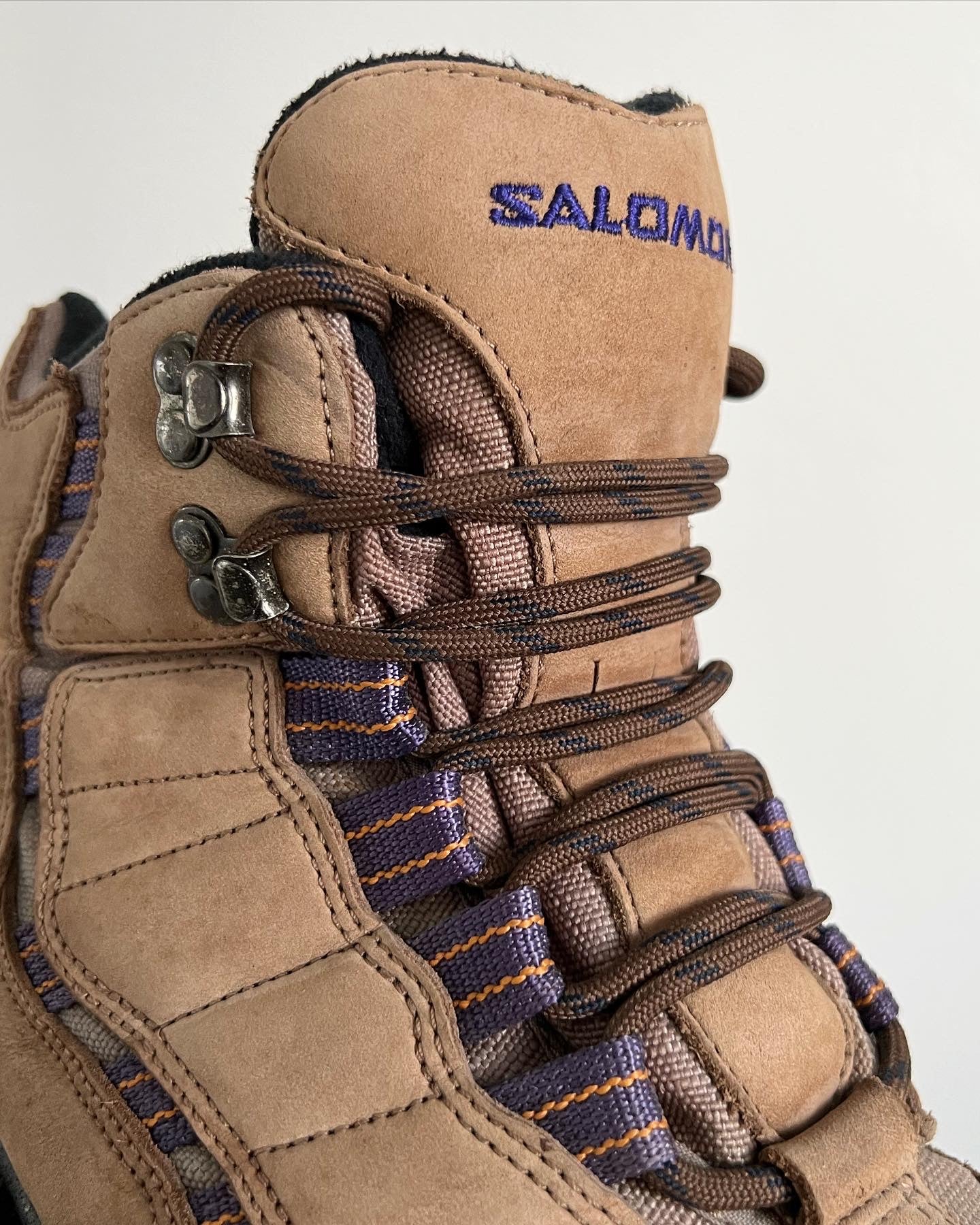 Salomon Early 2000s Vintage Contagrip Rugged Sole Boots - A pair of Salomon boots that have defied time, being more popular now than ever before. The boots feature a suede upper, with contrasting purple groves, a heel tab and boot lock toe. Overall an iconic pair of Salomons great for the outdoors or urban environments