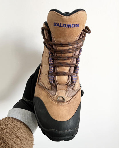 Salomon Early 2000s Vintage Contagrip Rugged Sole Boots - A pair of Salomon boots that have defied time, being more popular now than ever before. The boots feature a suede upper, with contrasting purple groves, a heel tab and boot lock toe. Overall an iconic pair of Salomons great for the outdoors or urban environments